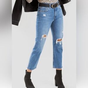 Levi’s 501. Size 29. Ankle length. Medium blue. Slightly distressed.